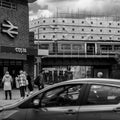 Railway Train Crossing A Bridge Ourside Kingston Railway Station With A Costa Coffee Shop And People