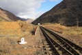 Railway train track in mountains Kyrgyzstan Royalty Free Stock Photo