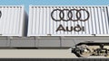 Railway transportation of containers with Audi logo. Editorial 3D rendering