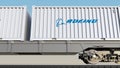 Railway transportation of containers with Boeing Company logo. Editorial 3D rendering