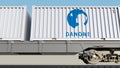 Railway transportation of containers with Danone logo. Editorial 3D rendering Royalty Free Stock Photo