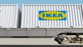 Railway transportation of containers with Ikea logo. Editorial 3D rendering