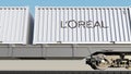 Railway transportation of containers with L`Oreal logo. Editorial 3D rendering