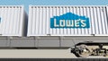 Railway transportation of containers with Lowe`s logo. Editorial 3D rendering