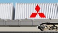 Railway transportation of containers with Mitsubishi logo. Editorial 3D rendering Royalty Free Stock Photo