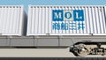 Railway transportation of containers with Mitsui O.S.K. Lines logo. Editorial 3D rendering