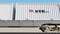 Railway transportation of containers with Nippon Yusen logo. Editorial 3D rendering