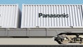 Railway transportation of containers with Panasonic Corporation logo. Editorial 3D rendering