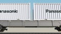 Railway transportation of containers with Panasonic Corporation logo. Editorial 3D rendering 4K clip
