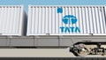 Railway transportation of containers with Tata Group logo. Editorial 3D rendering