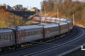 Railway turn with turning passenger train. Royalty Free Stock Photo