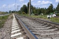 A railway under blue sky with clouds of white Royalty Free Stock Photo