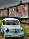 Railway wagon and small Fiat - Old rusted metal texture grunge background