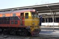 Railway worker cleans a locomotive windshield