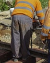 Railway workers bolting track rail. Royalty Free Stock Photo