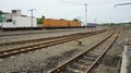 railway yard with freight containers and converging tracks Royalty Free Stock Photo