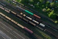 Railway yard with freight rail wagons. Cargo trains with goods on railroad. Royalty Free Stock Photo