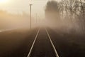 Railways at foggy morning horizontal Royalty Free Stock Photo