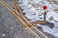Railways junction on a rocky ground with snow Royalty Free Stock Photo