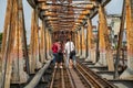 Railways on Long Bien ancient metal bridge with people taking photo on railways