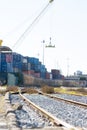 Railways near the warehouse with a bunch of containers in the open air