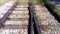 Railways. Rails and sleepers on the ground near the station. Long way concept. Interlacing of tracks, railway arrows. Royalty Free Stock Photo
