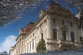 After rain in Bucharest, Romania - reflection of the house in a puddle Royalty Free Stock Photo