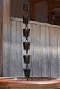 Japanese kusari rain chain hanging from a roof Royalty Free Stock Photo