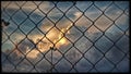 Storm clouds forming behind a wire fence Royalty Free Stock Photo