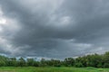 Rain clouds over the forest before a storm in rainy season. Royalty Free Stock Photo