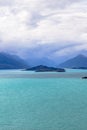 Rain clouds over snow-capped mountain. Wakatipu lake. New Zealand Royalty Free Stock Photo