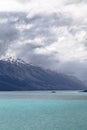 Rain clouds over snow-capped mountain. Wakatipu lake. New Zealand Royalty Free Stock Photo