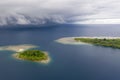 Aerial of Islands and Rain Clouds in Papua New Guinea Royalty Free Stock Photo