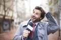 And the rain is really coming down now....A weatherman reporting on the weather during a rainstorm.