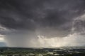 Rain curtaining a view of the mountains.Rain storm over Rice fie Royalty Free Stock Photo