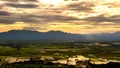 Rain curtaining a view of the mountains.Rain storm over Rice fie Royalty Free Stock Photo