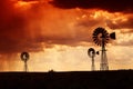 Rain in the desert at sunset