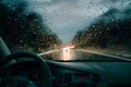 Rain drizzle on windshield in evening, driving in bad weather