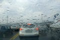 Rain drop on the car glass background.Road view through car window with rain drops, Driving in rain. Royalty Free Stock Photo