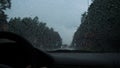 Rain drop on the car glass background.Road view through car window with rain drops, Driving in rain. Abstract traffic in raining d Royalty Free Stock Photo