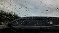 Rain drop on the car glass. Road view through car window with rain drops, Driving in rain Royalty Free Stock Photo