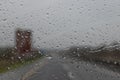 Rain drop on the cars windscreen . Abstract traffic in raining day. Road view through car window with rain . Royalty Free Stock Photo