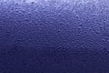 Rain drop on dark blue surface. Spring morning mood. Bright background or wallpaper. Texture of water droplets. Royalty Free Stock Photo