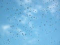 Rain drop on glass against blue sky Royalty Free Stock Photo