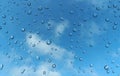 Rain drop on glass against blue sky Royalty Free Stock Photo