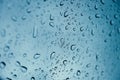 Rain drop wet moise on the glass blue cool fresh chill nature background Royalty Free Stock Photo