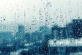 Rain drop on window glass over blurred big city Royalty Free Stock Photo