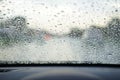 Rain droplets on car windshield, blocked traffic Royalty Free Stock Photo