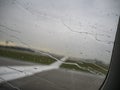 Rain drops on airplane window Royalty Free Stock Photo