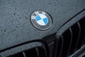 rain drops on black BMW car front parked in the street Royalty Free Stock Photo